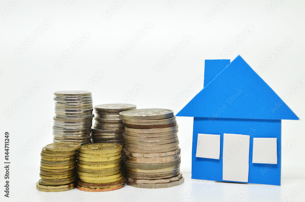 House model and stacks of coins House model and stacks of coins