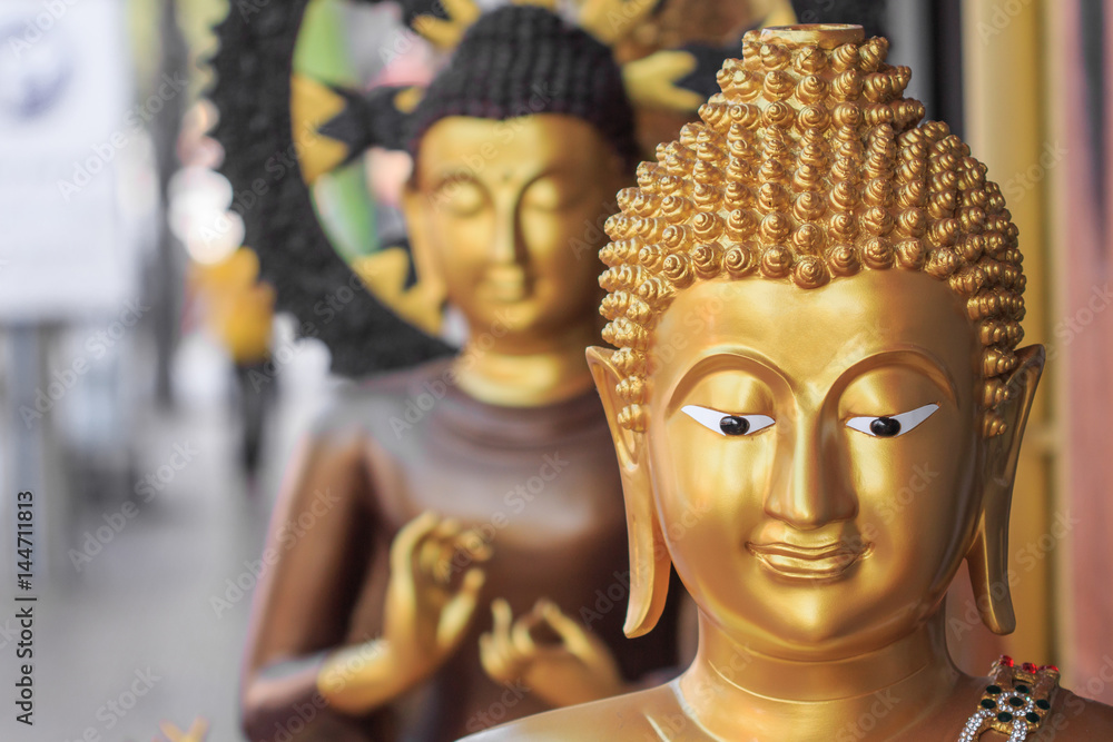 Buddhist statues on street, Thailand