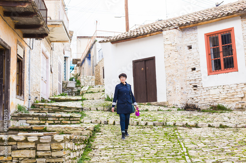 Stylish woman walking around old town. Female outdoors © satura_