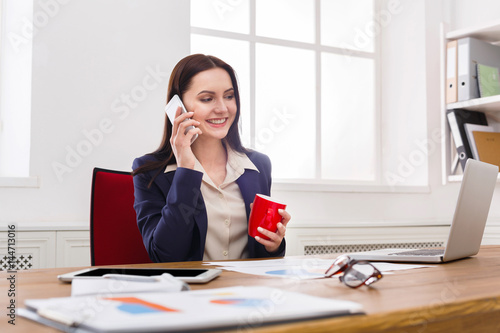 Business talk, woman consulting by phone at office © Prostock-studio