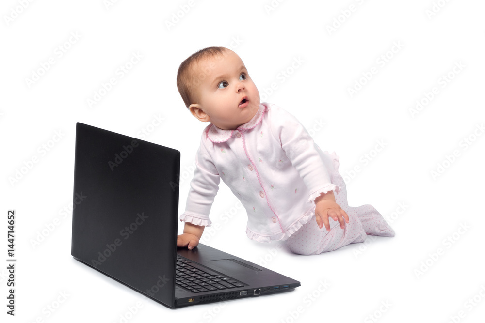 Smiling baby and laptop isolated on white Smiling baby and laptop isolated on white
