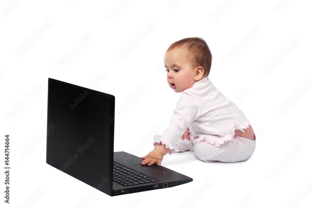 Smiling baby and laptop isolated on white Smiling baby and laptop isolated on white