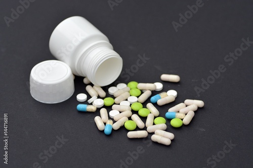 Pills on a black background