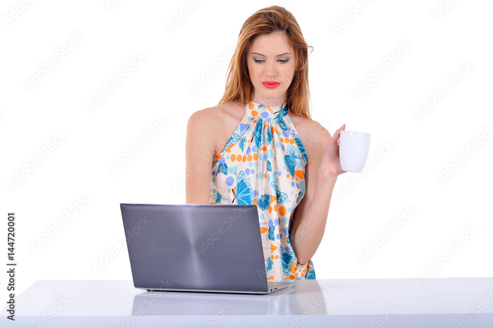 young blonde business woman working on laptop computer, isolated on white background. young blonde business woman working on laptop computer, isolated on white background.