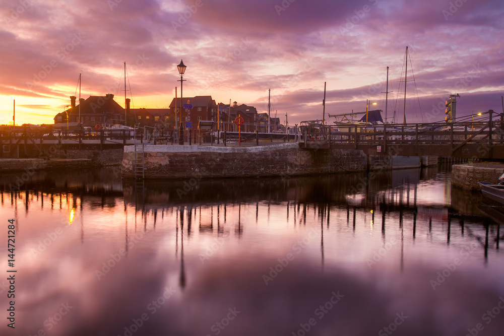 Evening in the harbor of the city of Exeter. Colorful, dramatic sunset. Devon. England