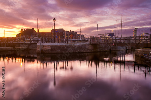 Evening in the harbor of the city of Exeter. Colorful, dramatic sunset. Devon. England