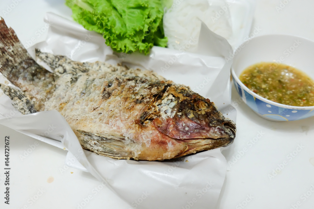 Thai Food fried fish mix herbs wrapped in leaves. Thai Food fried fish mix herbs wrapped in leaves.