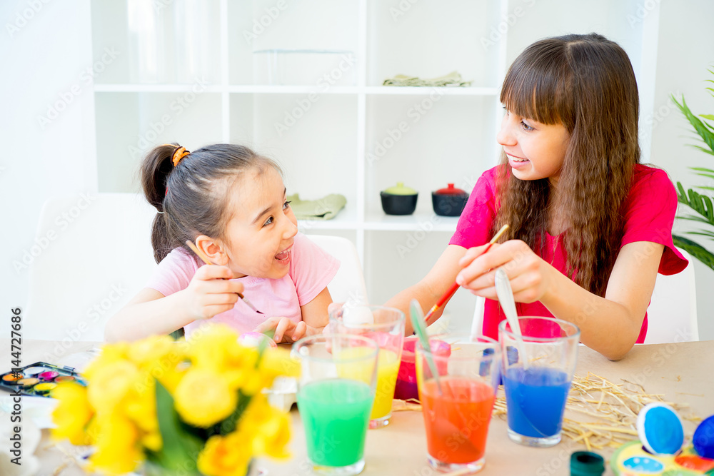 Children painting eggs Children painting eggs