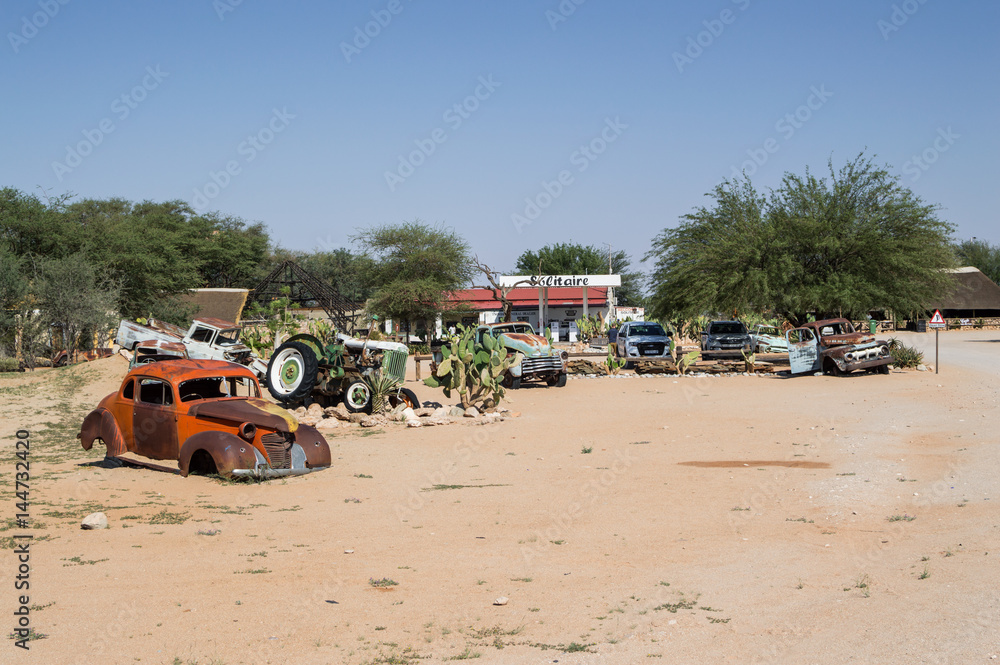 Old Timer Car Wrecks in a Desert Landscape in Solitaire, Namibia Old Timer Car Wrecks in a Desert Landscape in Solitaire, Namibia