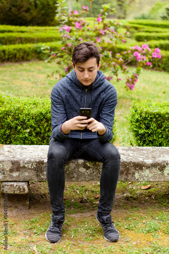 Obraz premium Cool teenager with fifty years old and a mobile