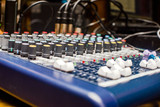 Blue DJ audio mixer shot close-up