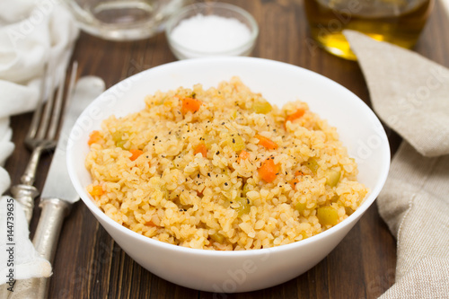 couscous with vegetables in white bowl