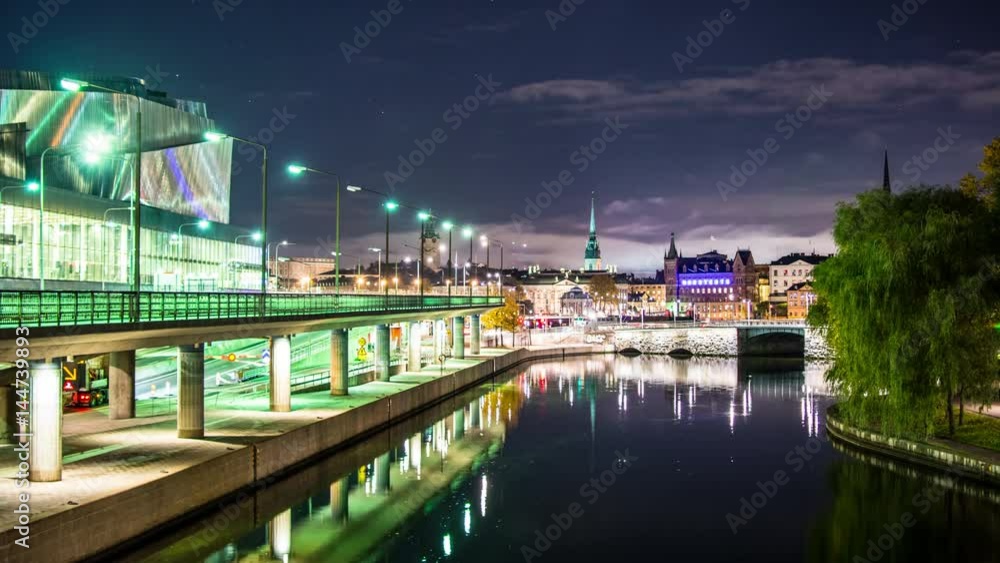 Stockholm city bridge at night 4K Time Lapse. The Capital city of Sweden, Scandinavia. Cityscape skyline and reflections in water canal Stockholm city bridge at night 4K Time Lapse. The Capital city of Sweden, Scandinavia. Cityscape skyline and reflections in water canal