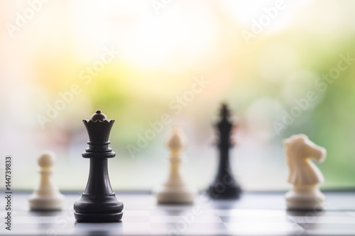 Chess pieces on board, business strategy