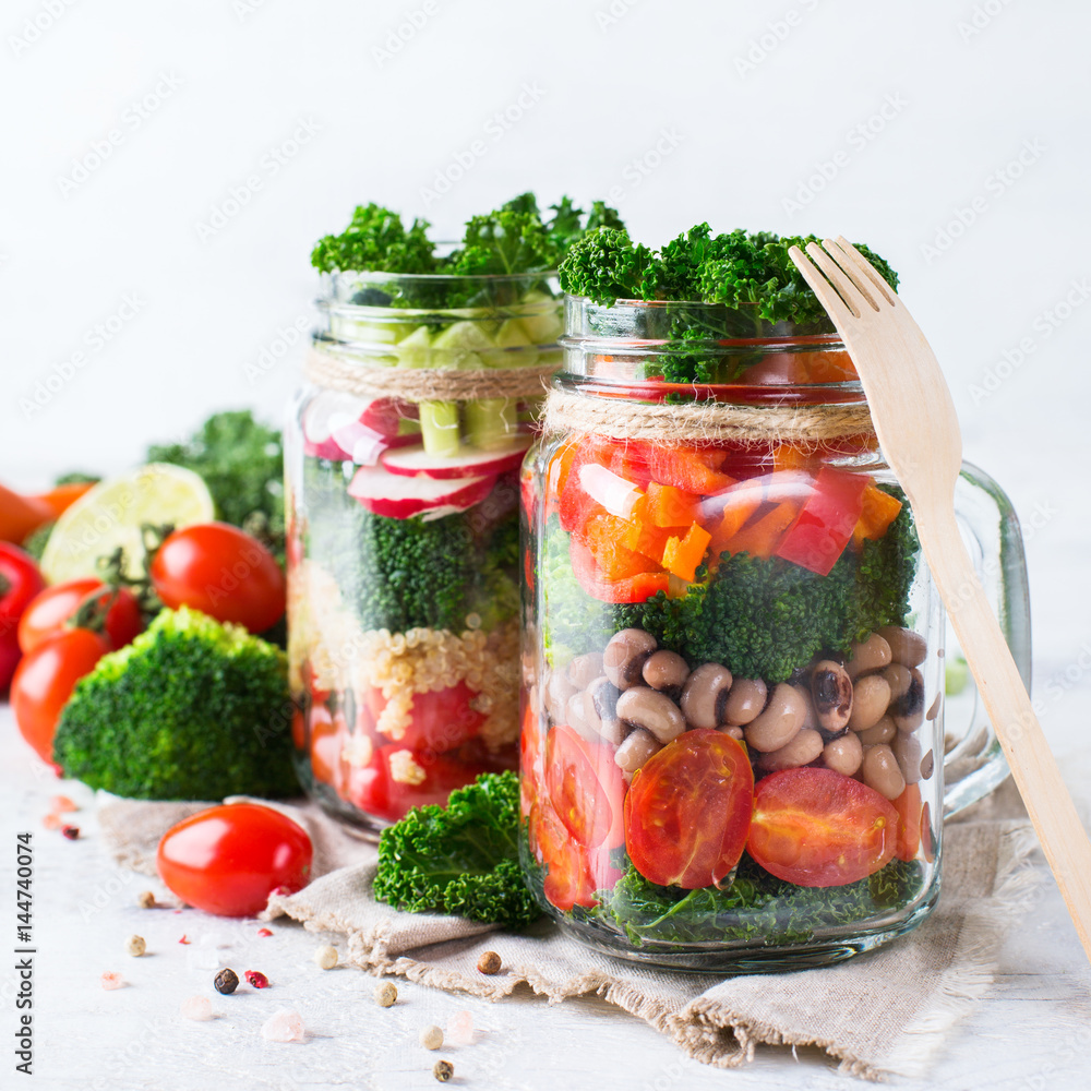 Healthy vegan salad in a mason jar with quinoa Healthy vegan salad in a mason jar with quinoa