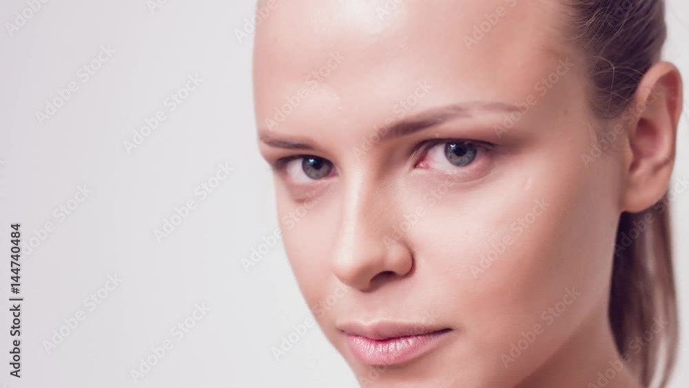 Beautiful girl without makeup looks at the camera. close up. Beautiful girl without makeup looks at the camera. close up.