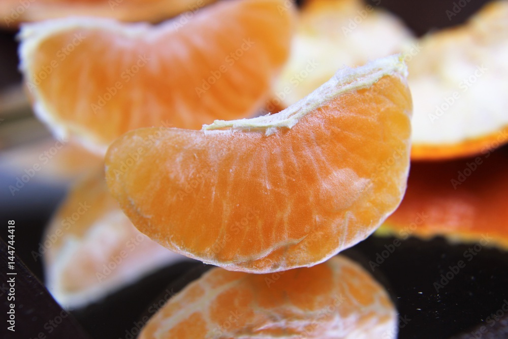Close up Mandarin on a mirror Close up Mandarin on a mirror