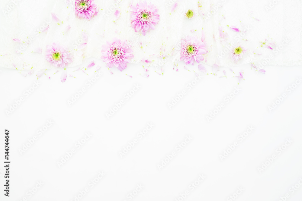 Pink flowers, purple petals on white background. Wedding dress. Flat lay, top view. Feminine  background