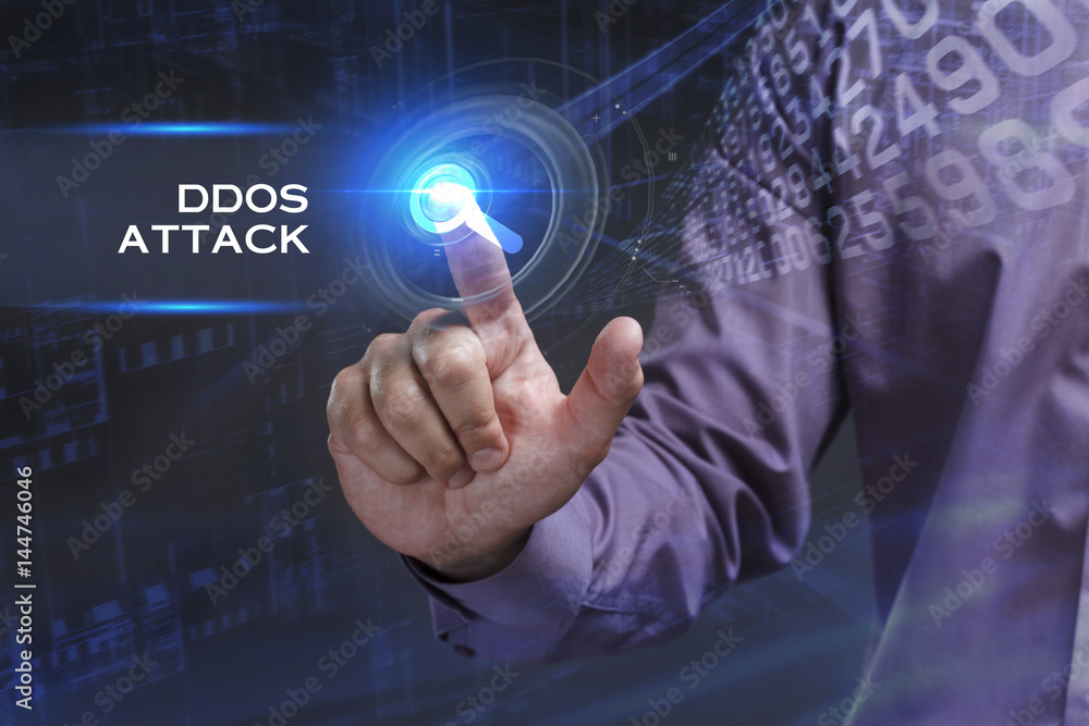 Fototapeta premium Business, Technology, Internet and network concept. Young businessman working on a virtual screen of the future and sees the inscription: Ddos attack