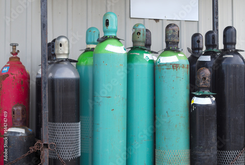 empty tanks propane oxygen nitrogen chemical gas bottles photo