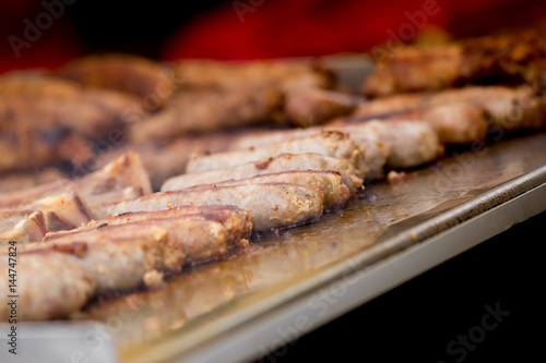 Cooking pork sausages in a street market