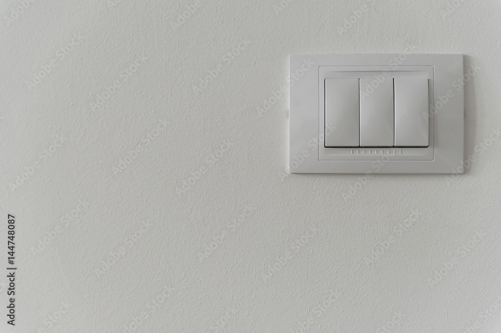 White light switch on a white wall White light switch on a white wall