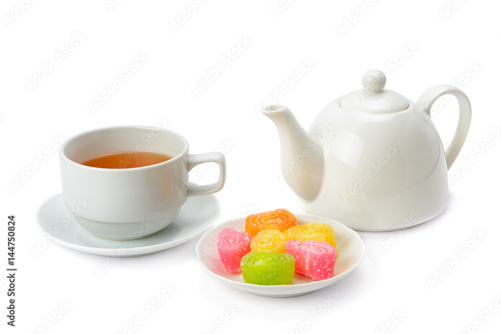 Fototapeta premium Teapot, tea in a cup and jujube isolated on white background.