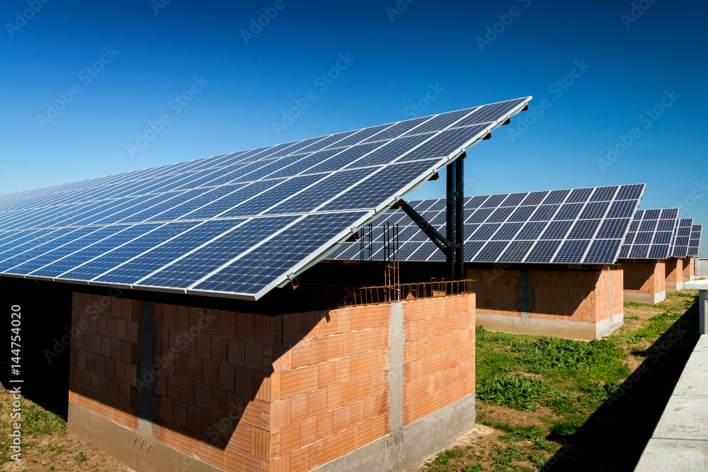 Fototapeta premium Solar panel, photovoltaic, alternative electricity source - selective focus, copy space