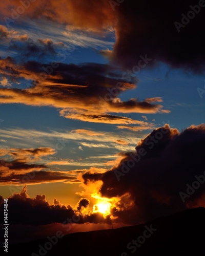 Vibrant sunrise with cloudy sky of vivid colors