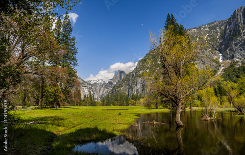 Mountain valley with lake, trees, sky, clouds