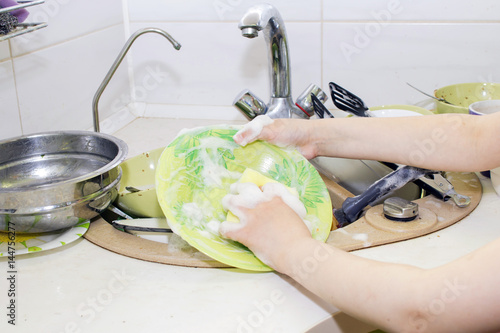 A bunch of dirty dishes in the kitchen. photo