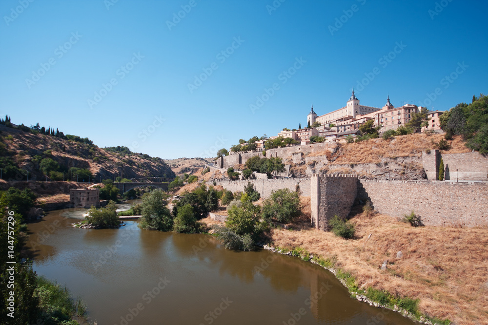 Old Toledo on the bank of the river Tajo. Blue sky. Sunny weather
