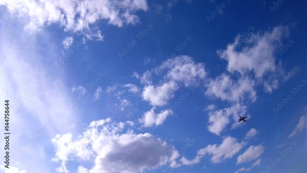 Clouds move quickly in the sky and slow when the plane is flying Clouds move quickly in the sky and slow when the plane is flying
