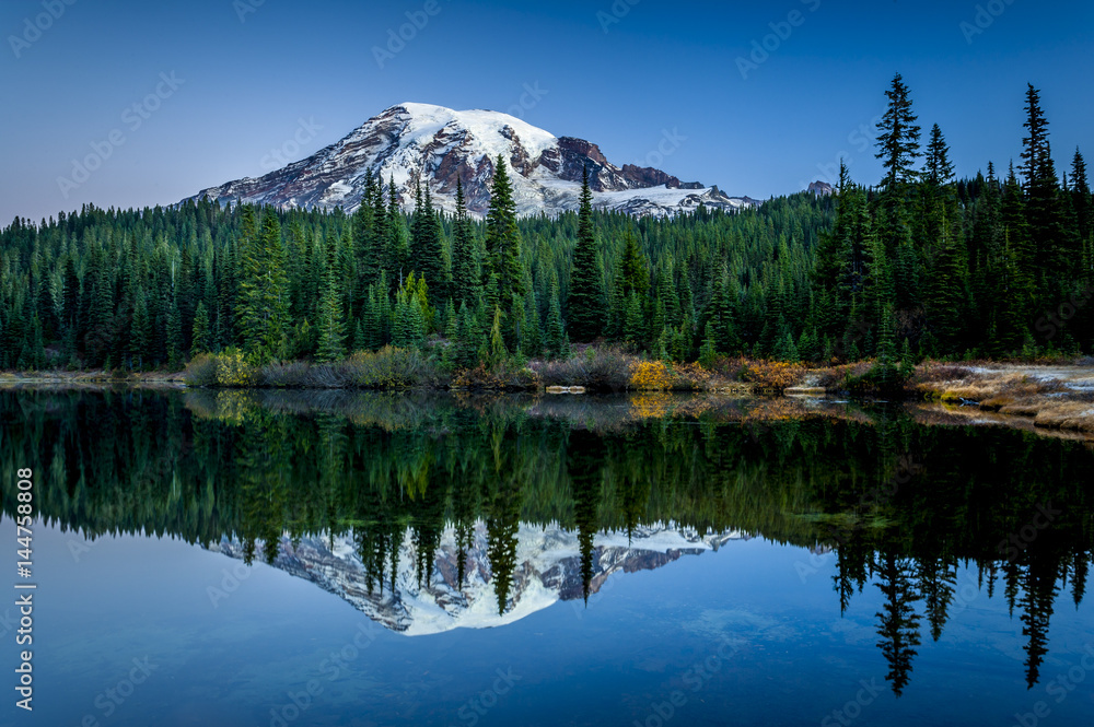 Mountain reflected in lake before dawn