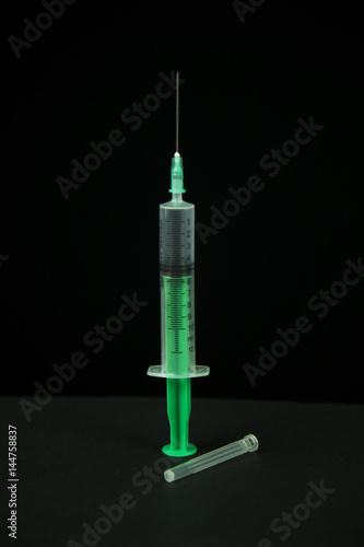 Medical needle isolated black background