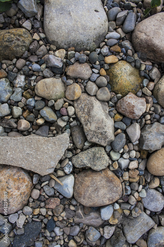 Multi colored rocks by river texture