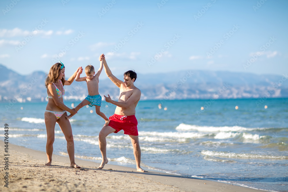 A family is having fun at the seashore of Mediterranean sea