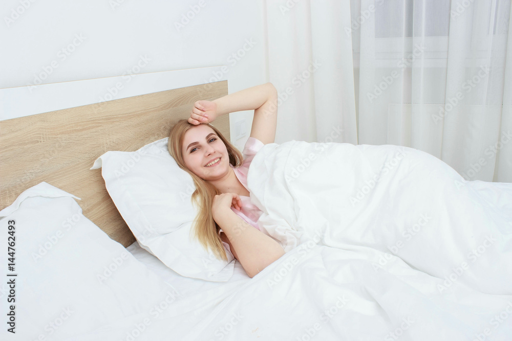 A beautiful girl resting on the bed