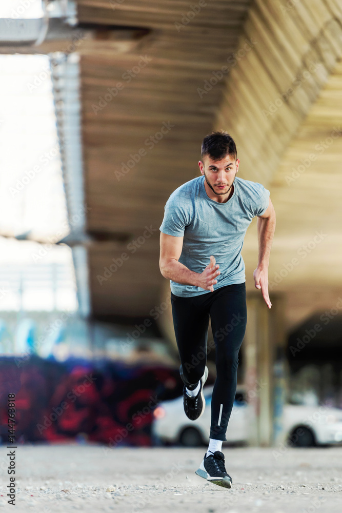 © lordn - Urban young runner having intensive training outdoors © lordn - Urban young runner having intensive training outdoors