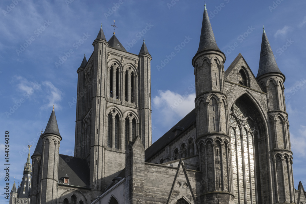 A view from the North West on the towers of the Saint Nicholas Church in Ghent, Belgium, in a sunny day in the beginning of spring