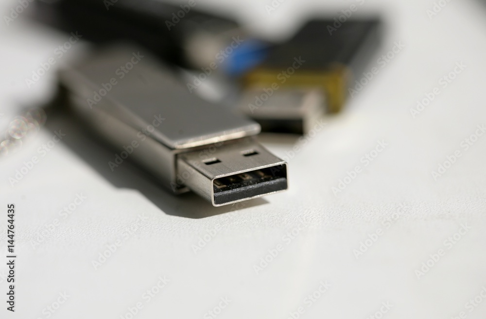 Close up of USB memory stick on white background; selective focus. Close up of USB memory stick on white background; selective focus.