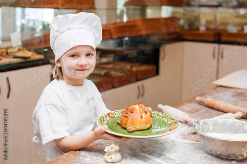 Portrait of a little chef cooking boy