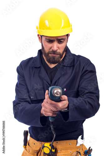 Young worker drilling