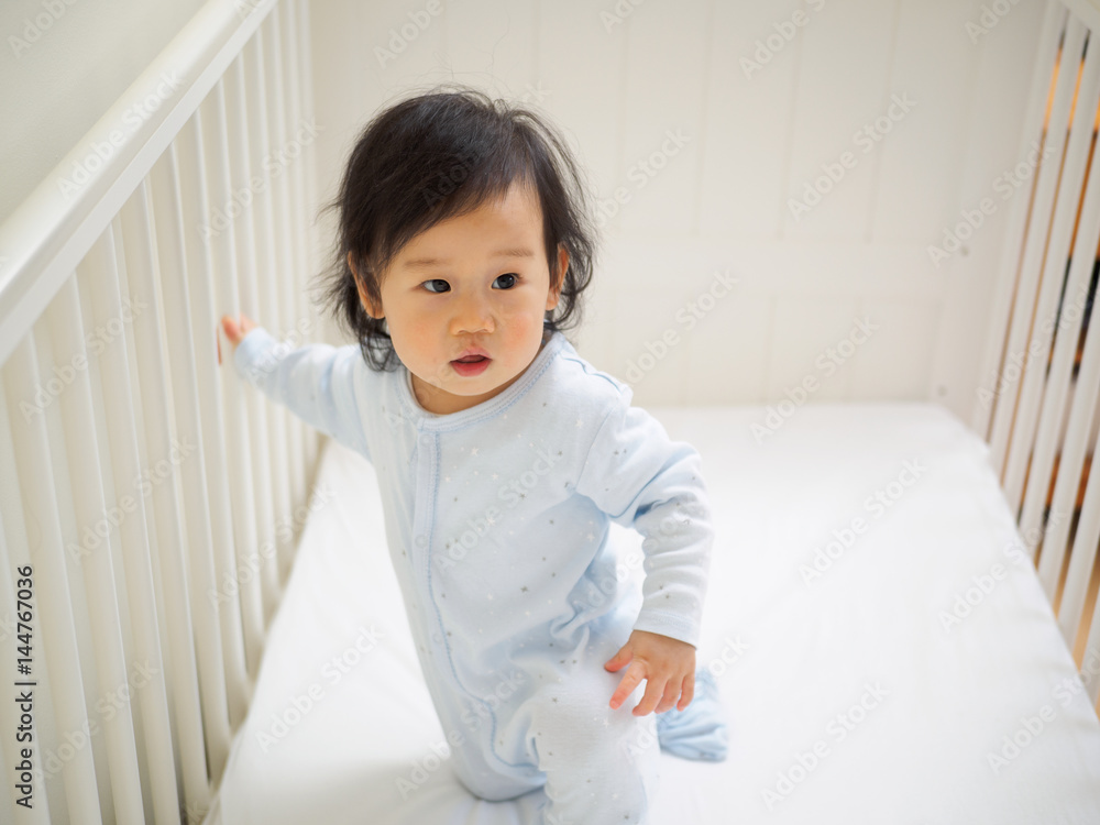 baby girl in cot baby girl in cot