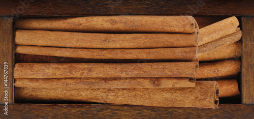 cinnamon (cassia) in wooden box isolated