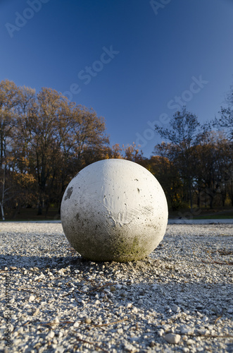 White sphere on the ground in park