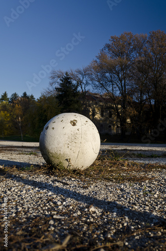 White sphere on the ground in park