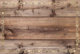 The frame is decorated with gears, on wooden background in steampunk style.