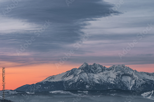 Poland  landscape  Tatra mountains under cloudy sky during sunrise  winter