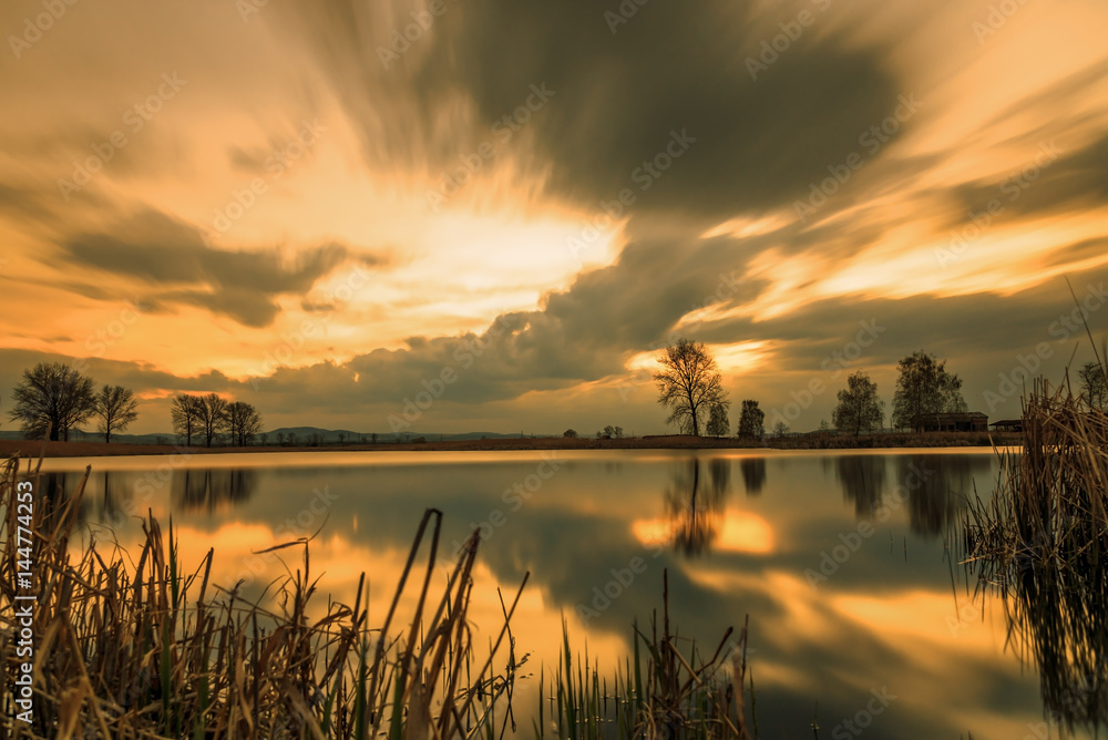 Magnificent long exposure lake sunset